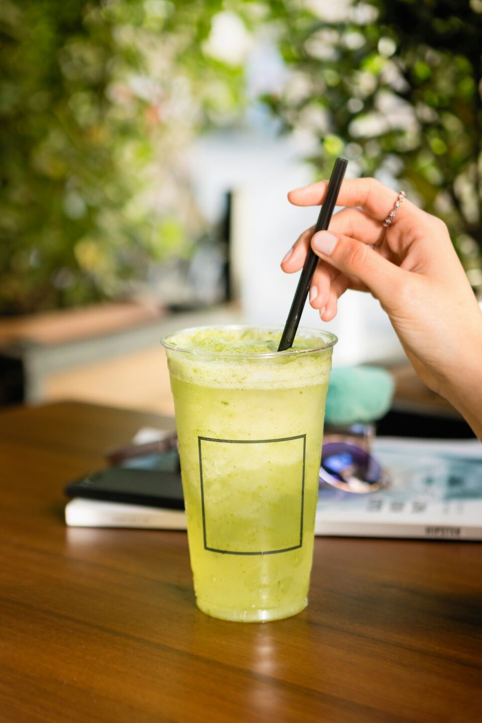 Green juice cup on a desk