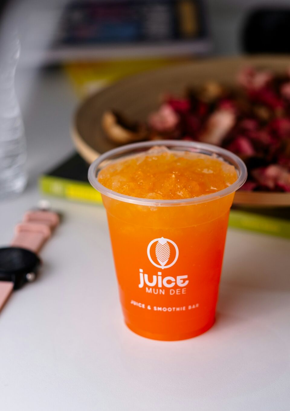 Green juice being poured into a glass