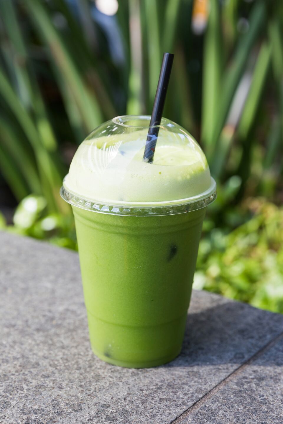 Green smoothie in a takeaway cup