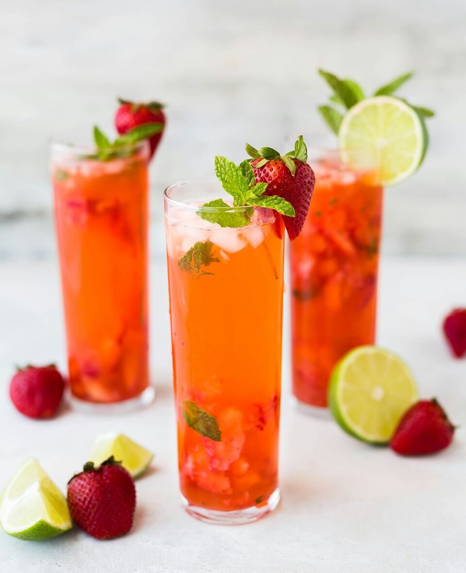 Colorful fruit juices lined up on a counter